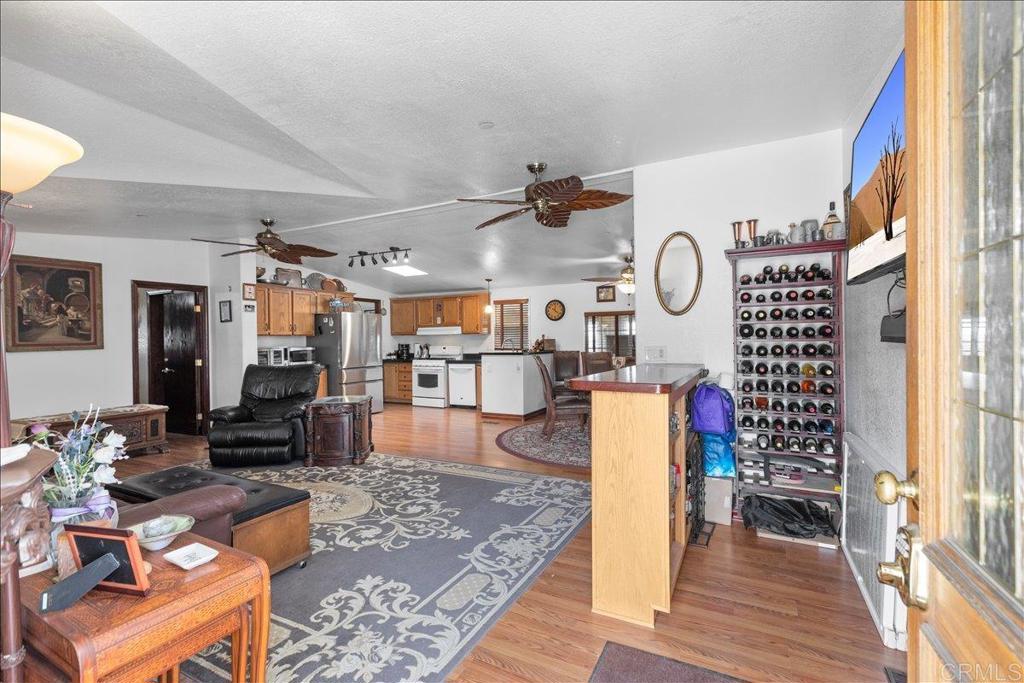 2285 Tierra Heights Road Boulevard, CA 91905 - Photo 7 of 51 a living room with furniture and wooden floor