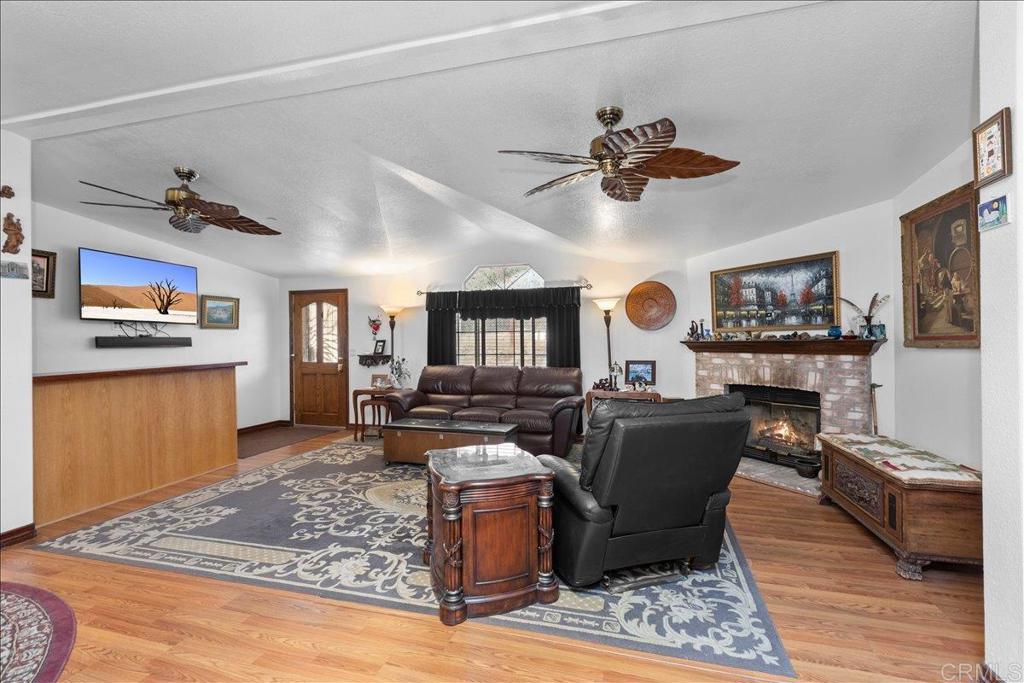2285 Tierra Heights Road Boulevard, CA 91905 - Photo 8 of 51 a living room with furniture and a wooden floor
