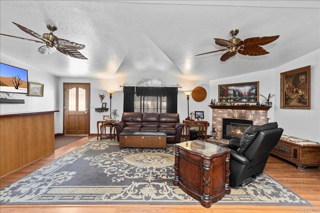 2285 Tierra Heights Road Boulevard, CA 91905 - Photo 10 of 51 a living room with furniture and a chandelier