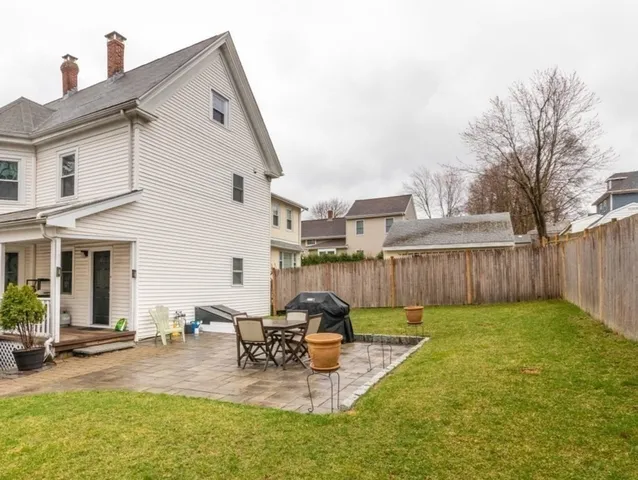 a view of a patio with a chairs and table in a patio