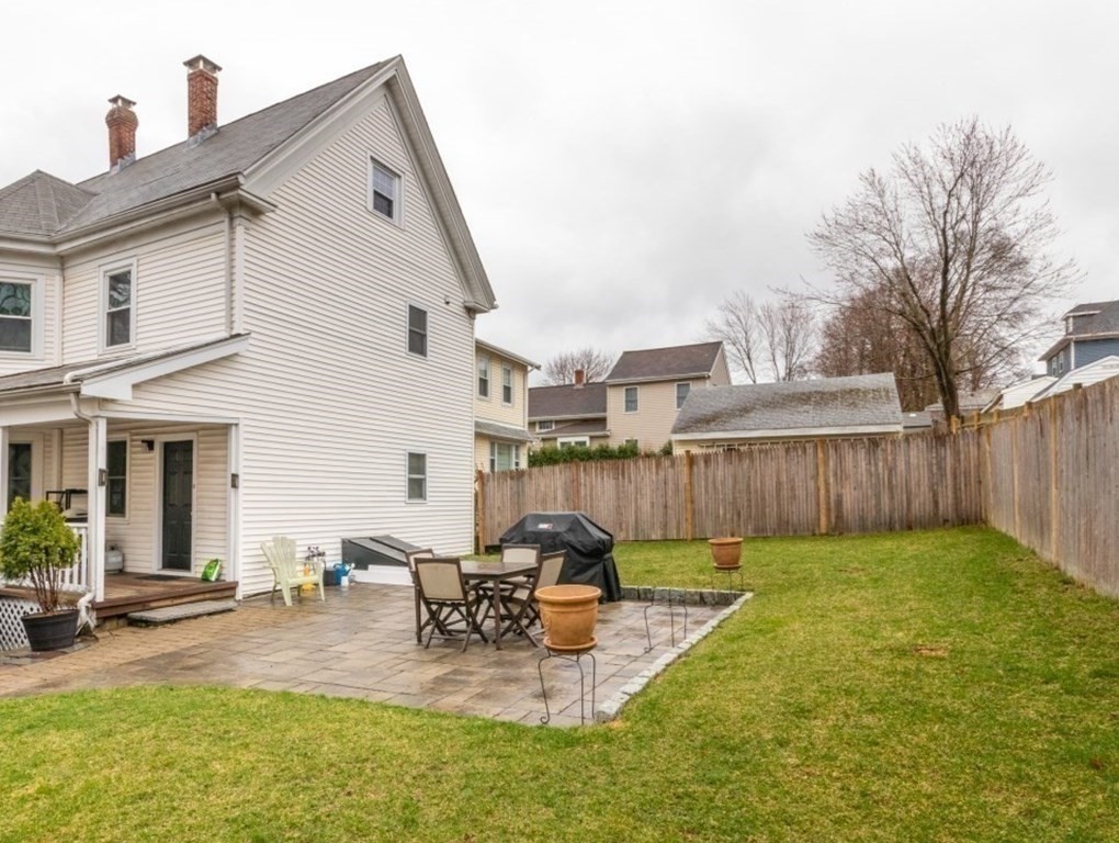 21 Denmark Avenue, Unit 2 Milton, MA 02186 - Photo 16 of 18 a view of a patio with a chairs and table in a patio