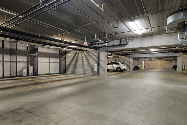 1199 East Port Clinton Road, Unit 208 Vernon Hills, IL 60061 - Photo 12 of 19 a view of parking garage with cars