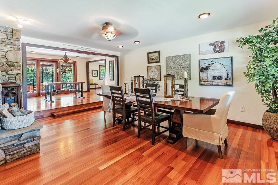 4190 Hackamore Drive Reno, NV 89519 - Photo 3 of 25 a dining room with wooden floor and large windows