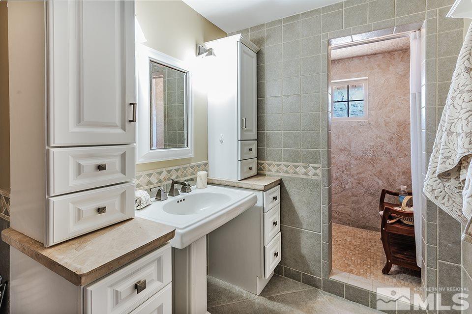 4190 Hackamore Drive Reno, NV 89519 - Photo 10 of 25 a bathroom with a sink and a mirror