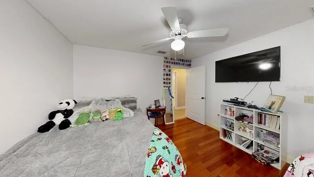 a bed room with a bed and a flat screen tv