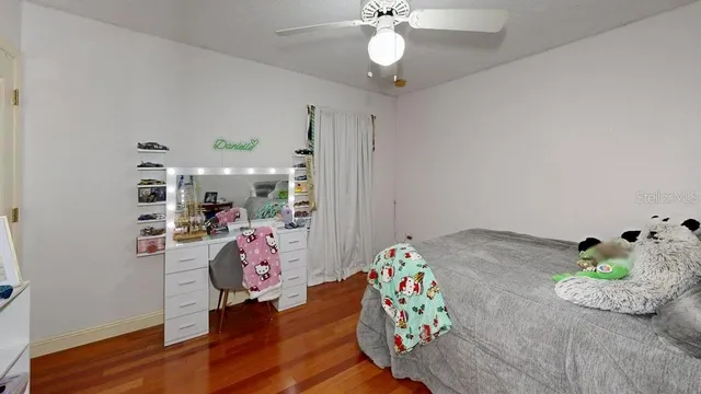 a bedroom with bed and a window