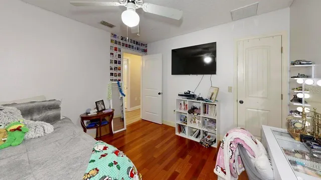 a view of a backyard with swimming pool