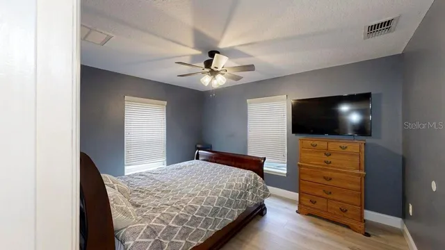 a bedroom with a bed and a dresser