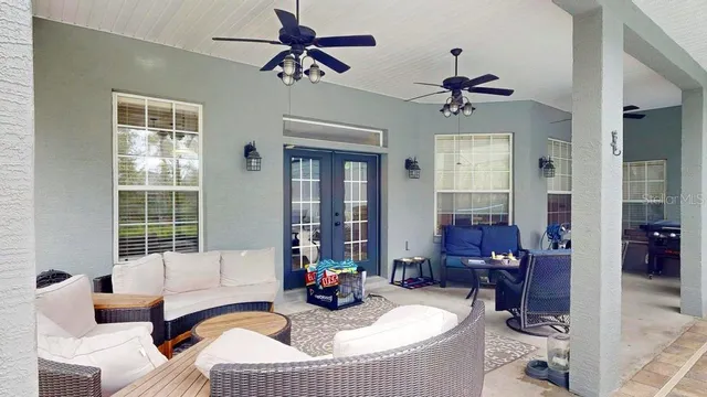 an aerial view of house with yard swimming pool and outdoor seating