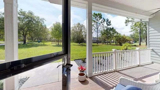 a kitchen with a sink a stove and chairs