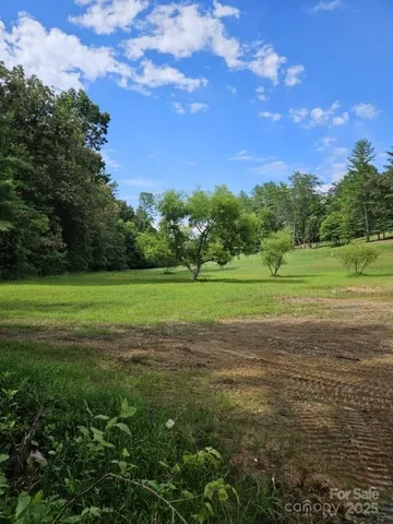 a view of a golf course with a lake