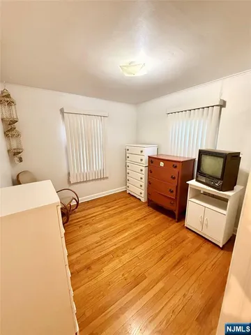 a bedroom with a bed and cabinets