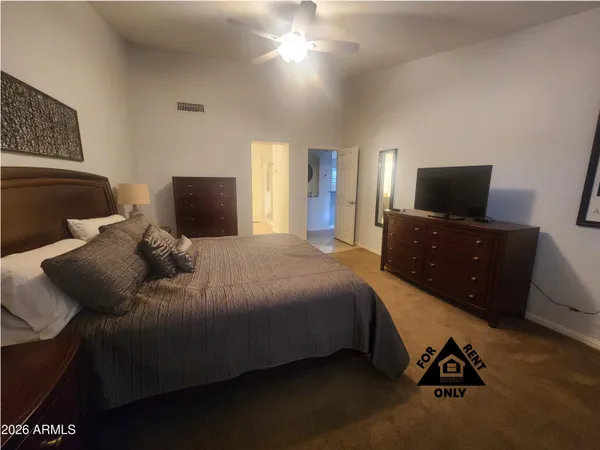 a bedroom with a bed and tv