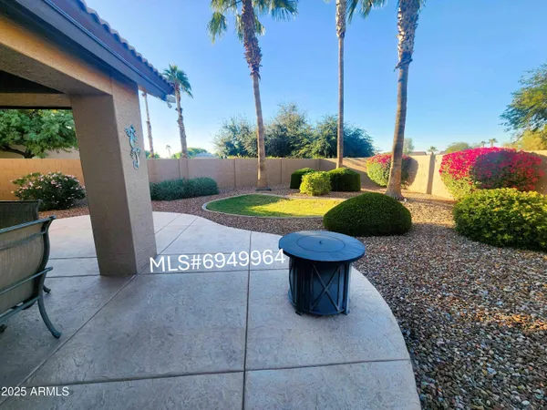 a view of a backyard of the house
