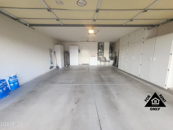 a view of a livingroom with an empty space and a window