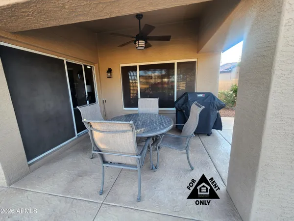 a view of a livingroom with furniture and a window