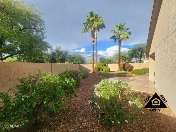 a view of a backyard with a garden