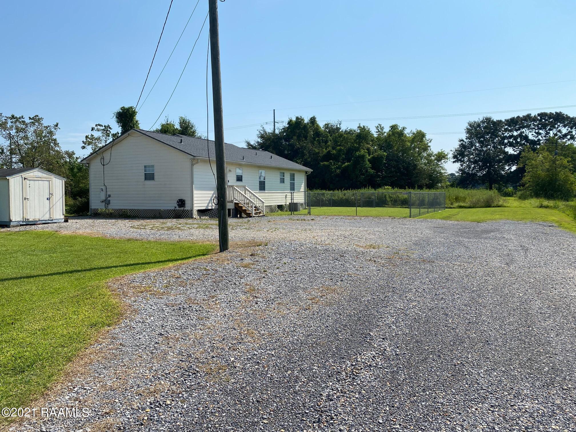 426 Hebert Road Scott, LA 70583 - Photo 18 of 21 Drive to Back of Home