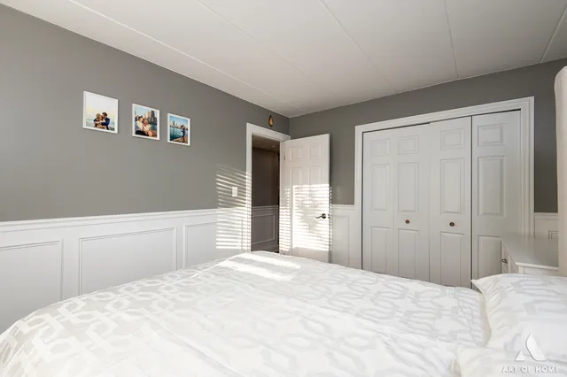 a large white bed in a white room