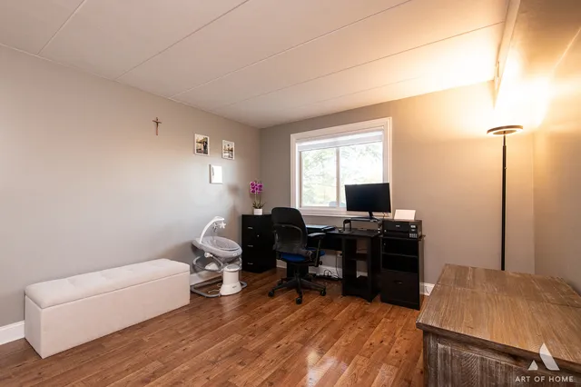 a workspace with furniture and wooden floor