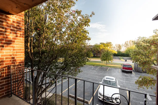 a view of a balcony with chairs