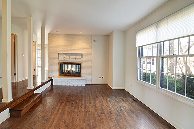 851 South County Line Road Hinsdale, IL 60521 - Photo 2 of 25 a view of an empty room with a window and wooden floor