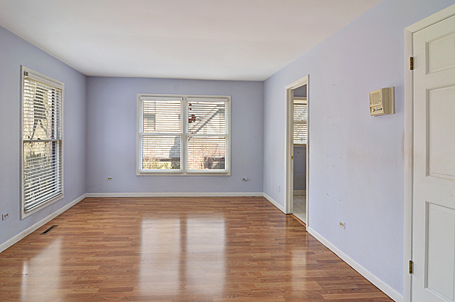 851 South County Line Road Hinsdale, IL 60521 - Photo 20 of 25 a view of an empty room with wooden floor and a window