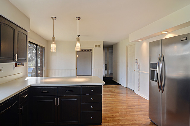 851 South County Line Road Hinsdale, IL 60521 - Photo 6 of 25 a kitchen with stainless steel appliances granite countertop a refrigerator a sink and a stove