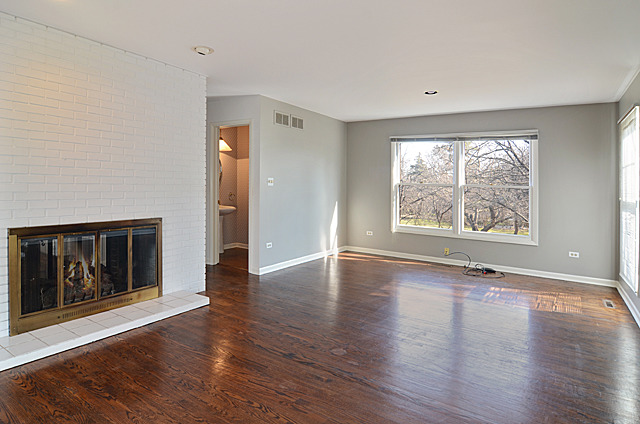 851 South County Line Road Hinsdale, IL 60521 - Photo 8 of 25 an empty room with wooden floor and windows