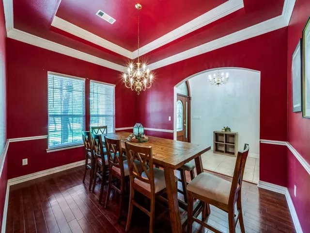 a view of a dining room with furniture and window