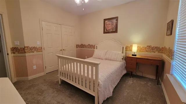 a room with a bed and a night stand