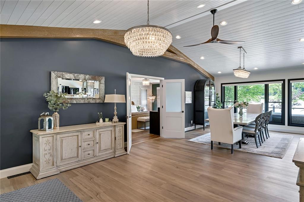 13399 Treasure Lake Road Du Bois, PA 15801 - Photo 13 of 49 a room with stainless steel appliances a kitchen island a chandelier wooden floor and a view of kitchen