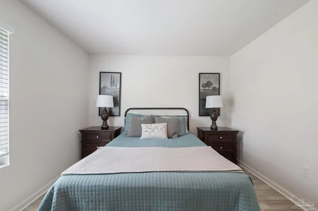 a bedroom with a bed and window