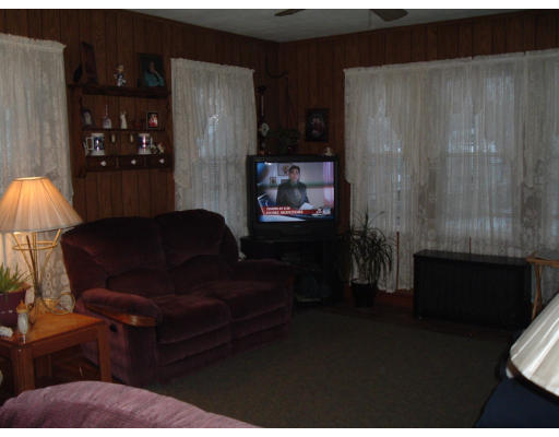 75 Redlands Street Springfield, MA 01104 - Photo 6 of 10 a living room with furniture and a lamp