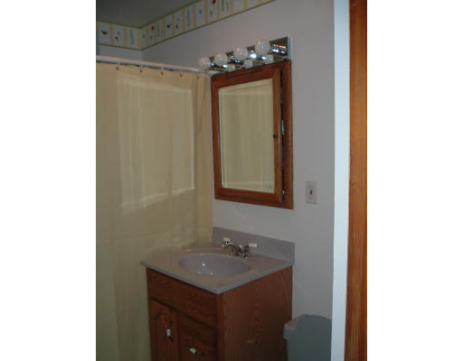 75 Redlands Street Springfield, MA 01104 - Photo 8 of 10 a bathroom with a sink and a mirror