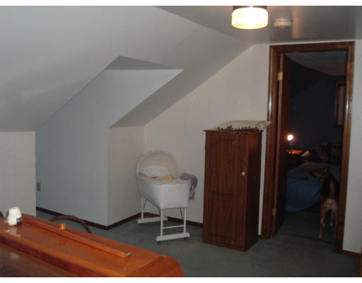 75 Redlands Street Springfield, MA 01104 - Photo 9 of 10 a view of a hallway with wooden floor and chair