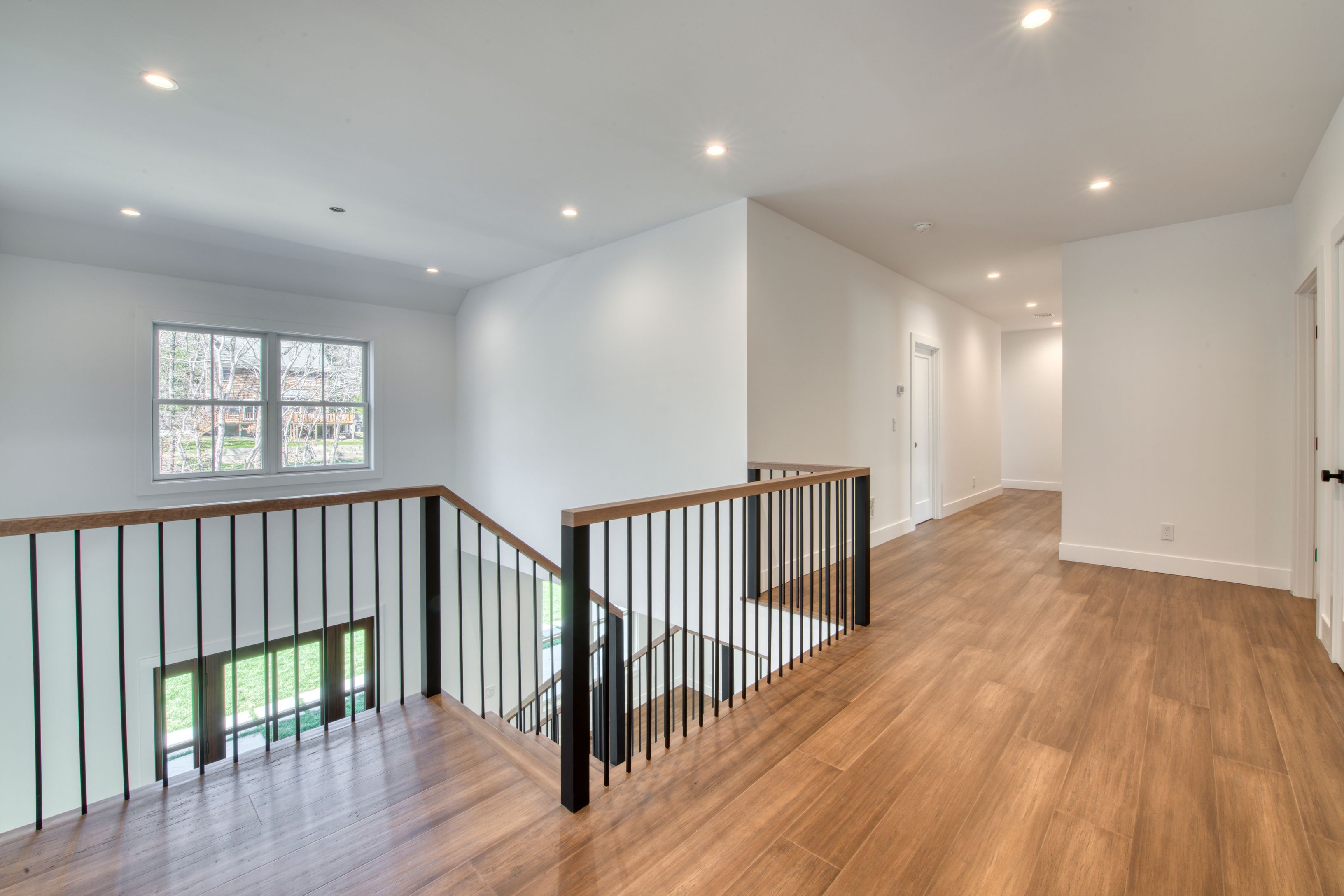 18 Barnes Avenue East Hampton, NY 11937 - Photo 13 of 35 a view of hallway with wooden floor