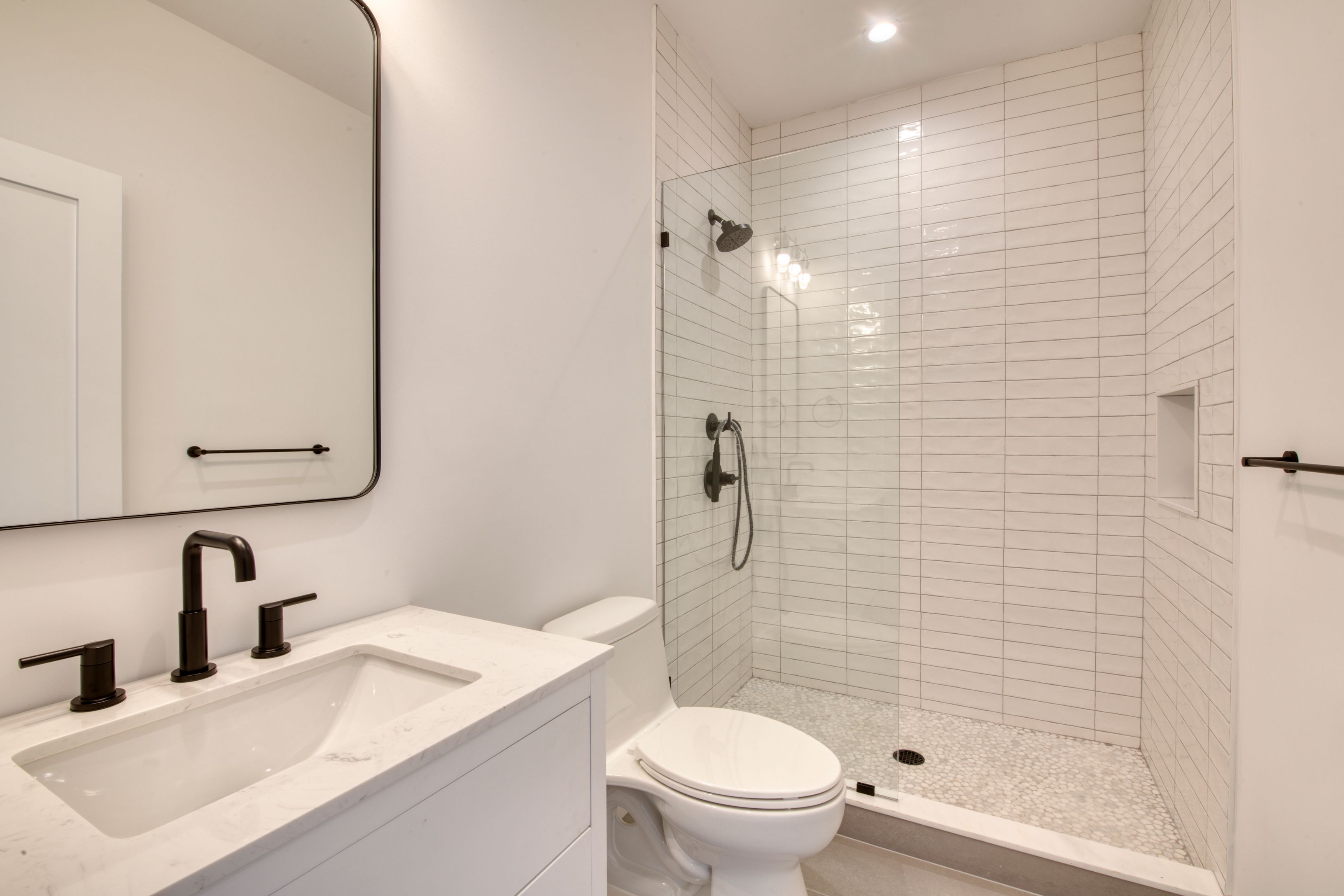 18 Barnes Avenue East Hampton, NY 11937 - Photo 18 of 35 a bathroom with a sink toilet and shower
