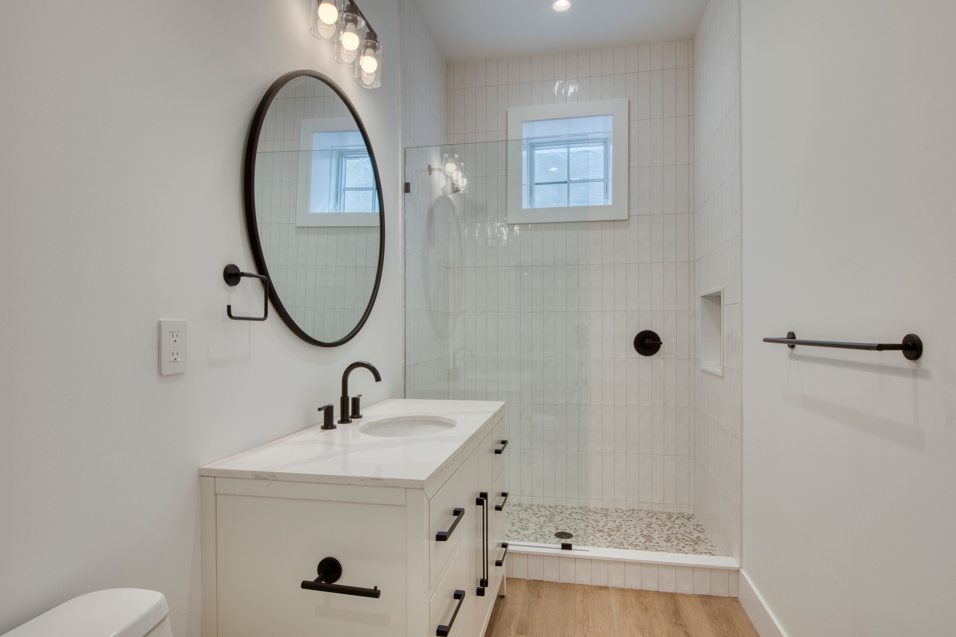 18 Barnes Avenue East Hampton, NY 11937 - Photo 21 of 35 a bathroom with a sink a toilet and a mirror