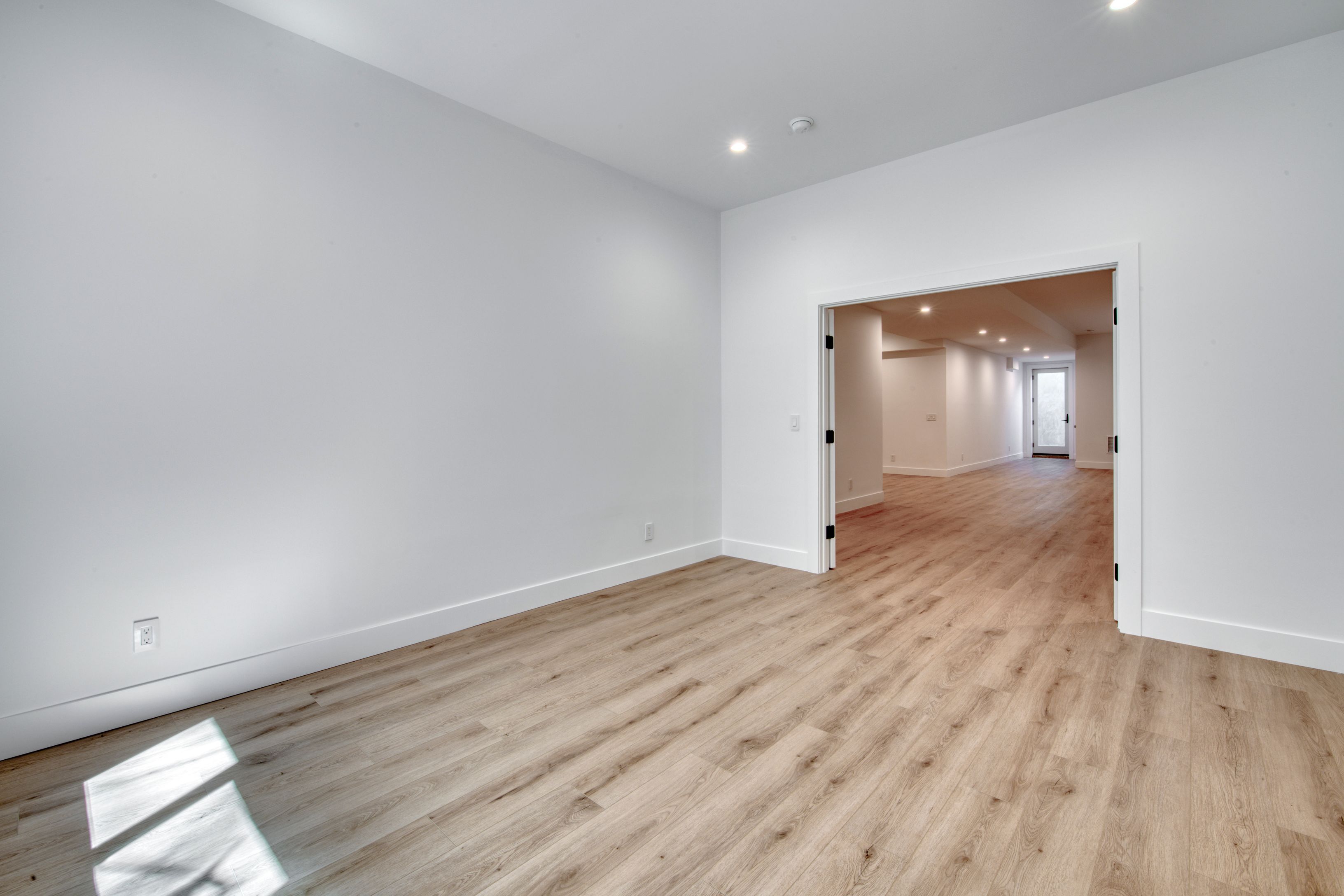 18 Barnes Avenue East Hampton, NY 11937 - Photo 23 of 35 wooden floor in an empty room