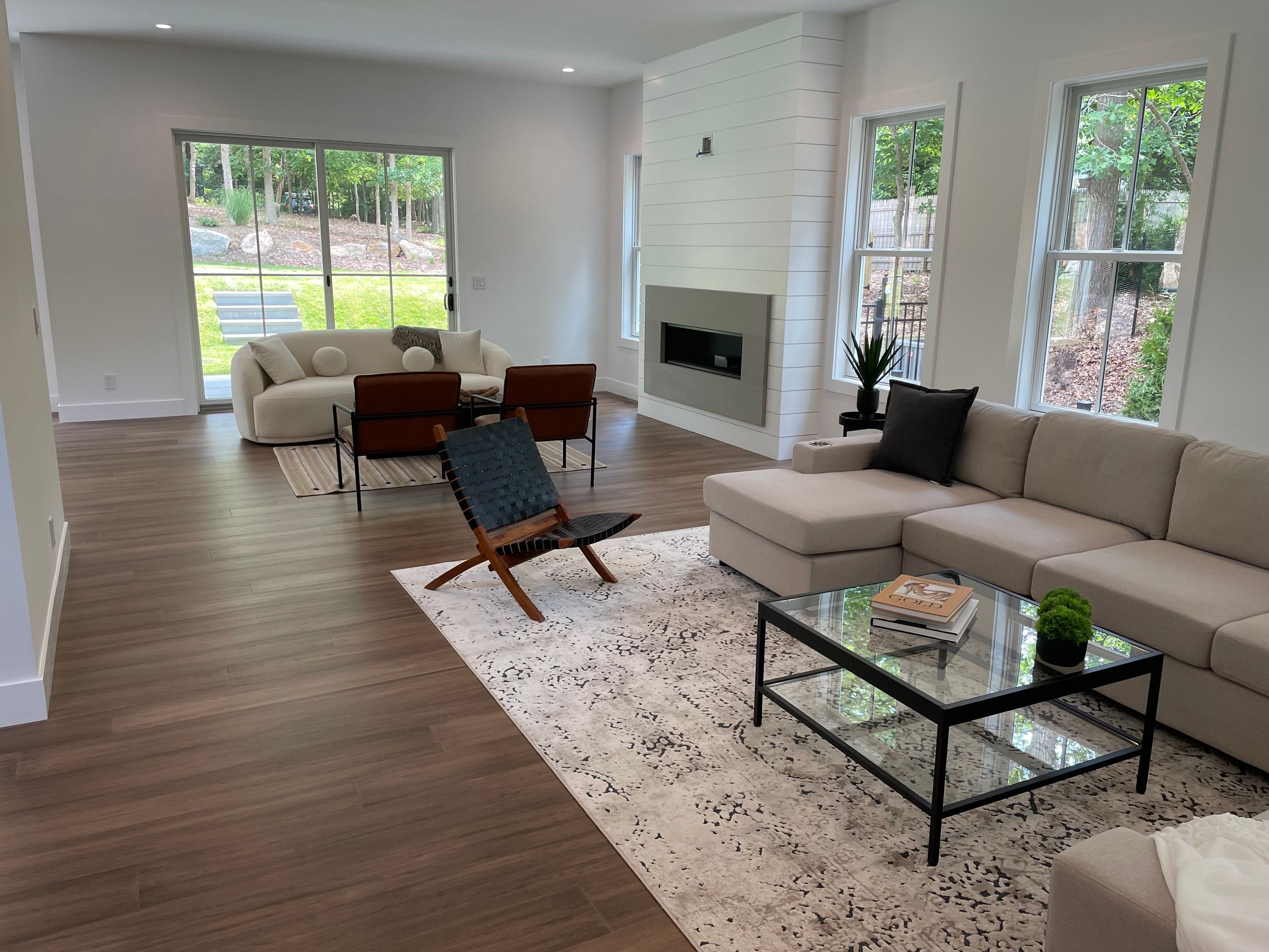 18 Barnes Avenue East Hampton, NY 11937 - Photo 34 of 35 a living room with furniture fireplace and a large window
