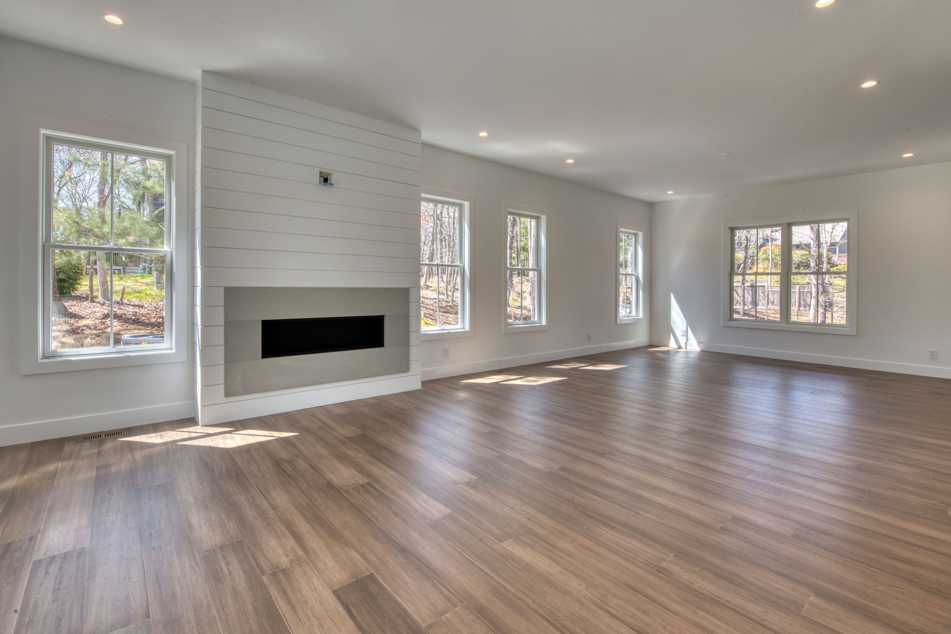 18 Barnes Avenue East Hampton, NY 11937 - Photo 9 of 35 a view of an empty room with wooden floor and a window