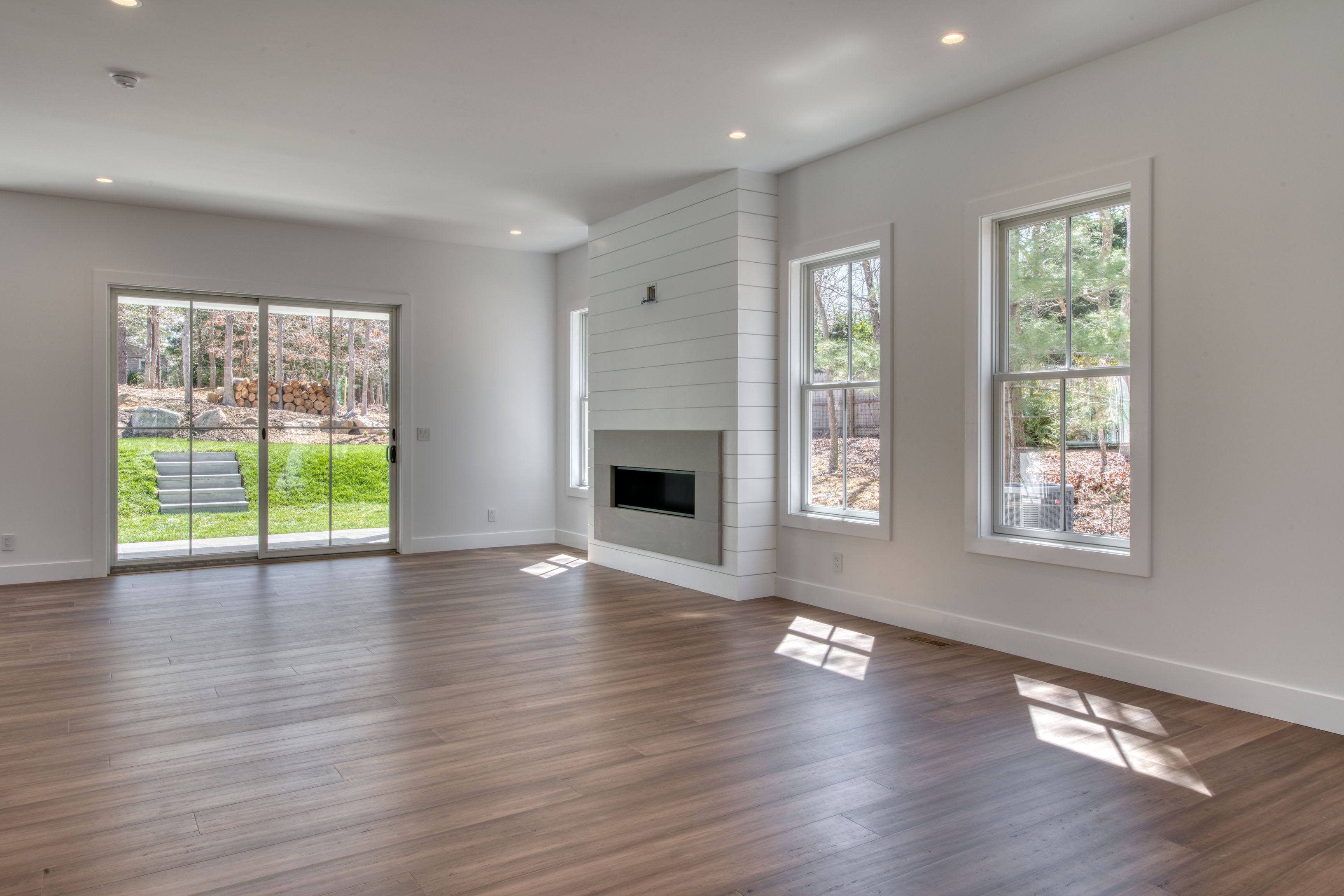18 Barnes Avenue East Hampton, NY 11937 - Photo 10 of 35 a view of an empty room with wooden floor and a window