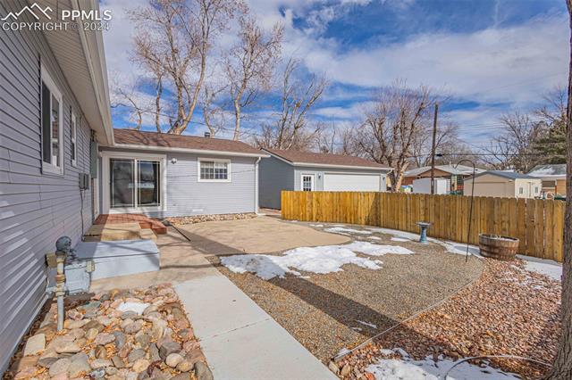2125 Winston Road Colorado Springs, CO 80909 - Photo 22 of 37 View of yard with a patio