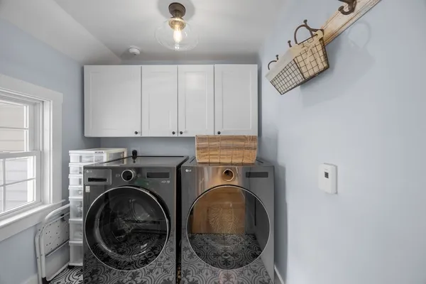 a utility room with dryer and washer