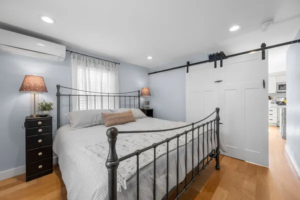 a bed room with two beds and a night stand