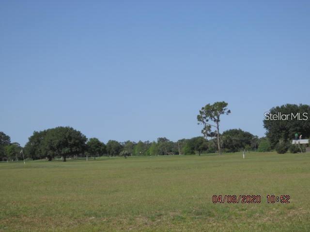 Calendula Drive Frostproof, FL 33843 - Photo 5 of 13 a view of a lake and mountain in the back