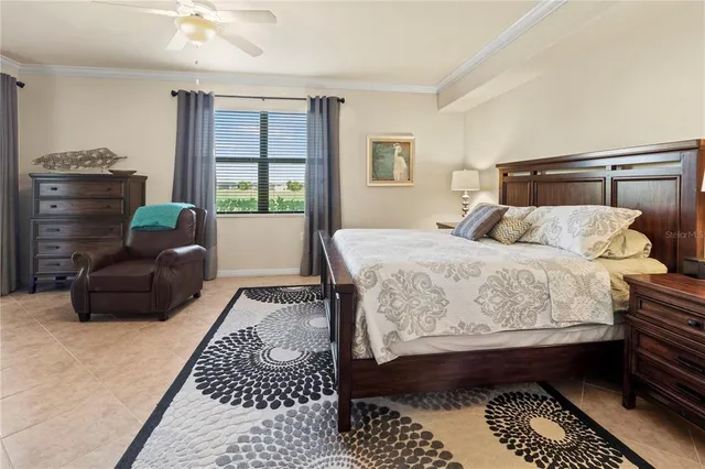 a bedroom with a bed a couch and dresser