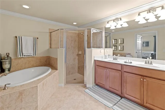 a bathroom with a tub and a shower