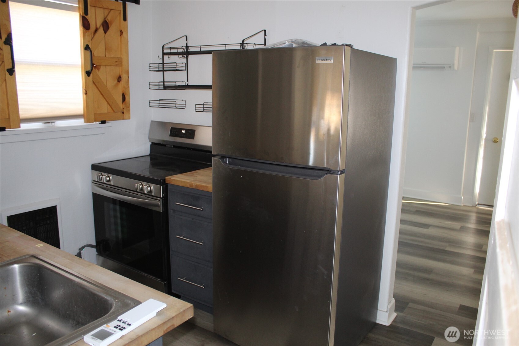 512 West Broadway Avenue Ritzville, WA 99169 - Photo 15 of 16 a kitchen with metallic refrigerator and window